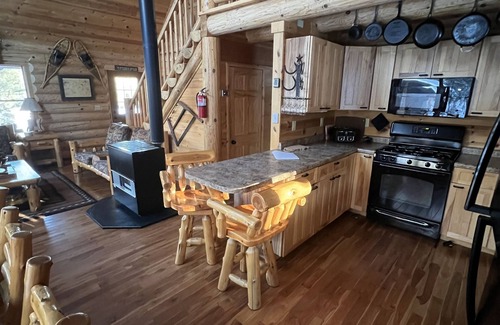 Champion Cabine | Log lodge à distance dans les contreforts Huron Mountain
