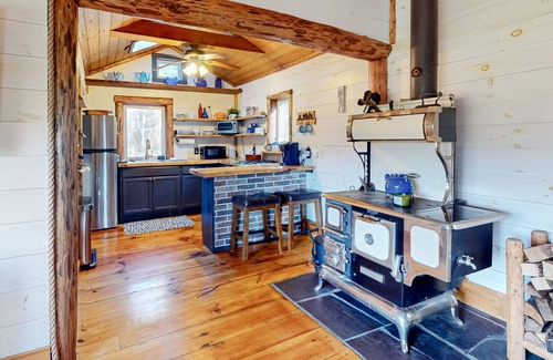 North Troy Cabine | Renovated historic cabin with mountain views, lake access, & electric fireplace