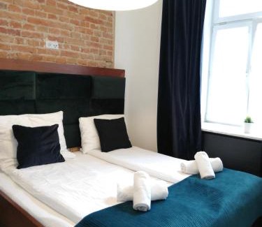 Srodmiescie Lit Et Petit-Déjeuner | Rooms by Apartamenty Lubartowska Street