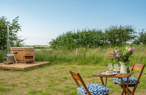 Wells-next-the-Sea Cabine | This bespoke hut is situated on the edge of the marsh with uninterrupted views out to the sea.
