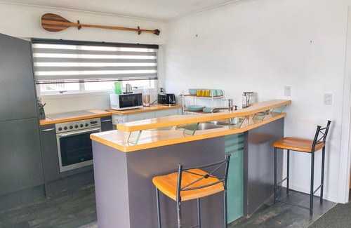 Pukehina Maison | "Salty Dog Beach Bach" is a comfortable and no-frills beachfront retreat.