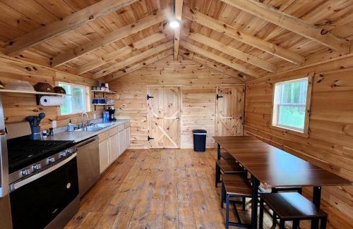White Cloud Maison | Secluded Rustic Cabins with Private Pond & Trails near ORV Routes in White Cloud, Michigan
