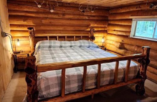 White Cloud Maison | Secluded Rustic Cabins with Private Pond & Trails near ORV Routes in White Cloud, Michigan