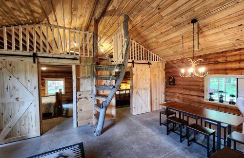 White Cloud Maison | Secluded Rustic Cabins with Private Pond & Trails near ORV Routes in White Cloud, Michigan