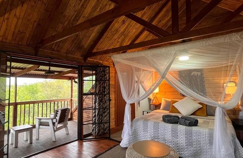 Marloth Park Cabine | See the Big 5 from the viewing deck of this incredible riverside bush lodge!