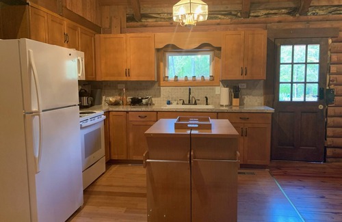 Apex Maison | Serene Log Home w pond, fenced-in yard & pastures