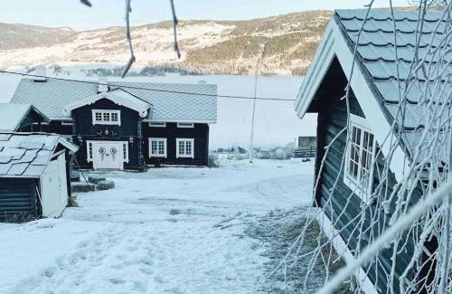Hundorp Appartement | Sjarmerende tømmerhytte på gårdstun