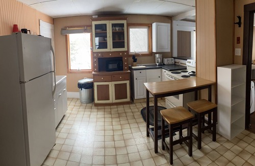 Patten Maison | Snowmobile trail access. Room for multi-vehicle/trailer parking.