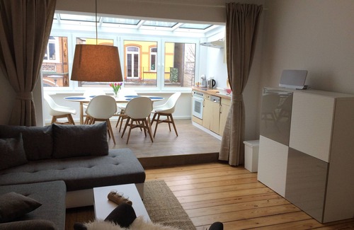 Warnemuende Appartement | « Voile solaire » Inside out: central comme il se - avec jardin d'hiver