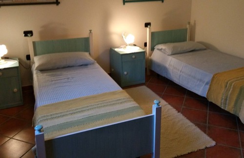 Giba Appartement | Splendid apartment in a semi-detached house, air conditioning. and large garden