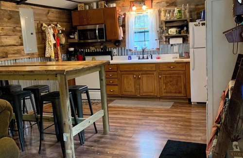 Cool Ridge Cabine | Step back in time with this unique cozy cabin by the creek.