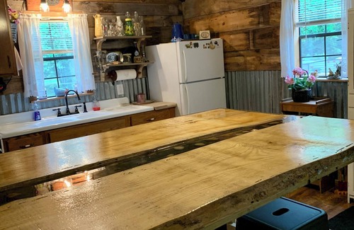 Cool Ridge Cabine | Step back in time with this unique cozy cabin by the creek.