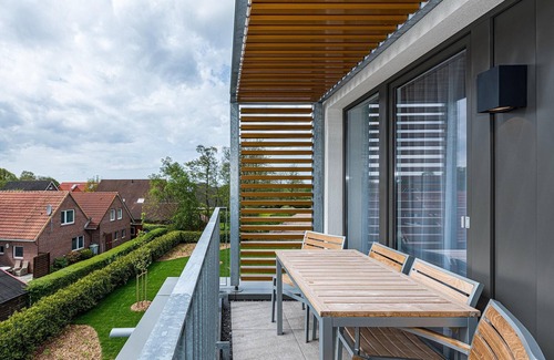 Bensersiel Appartement | Strandnahes Ferienapartment mit Balkon, Parkplatz, Schwimmbad- & Saunanutzung