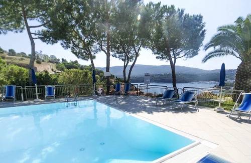 Porto Azzurro Appartement | Studio 4 with sea view pool in a panoramic position above the village of Porto Azzurro