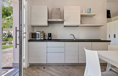 Dro Appartement | Studio 'Monte Brento Gaggiolo' avec vue sur les montagnes et jardin privé