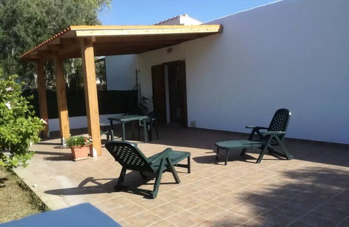 Calasetta Cottage | Studio apartment with patio in front and back terrace with veranda