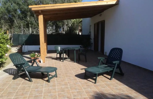 Calasetta Cottage | Studio apartment with patio in front and back terrace with veranda