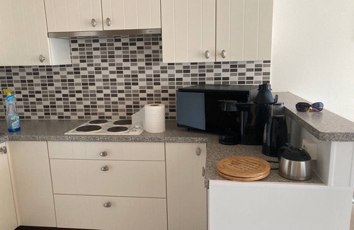 De Panne Appartement | Studio vue sur mer avec piscine interieure.