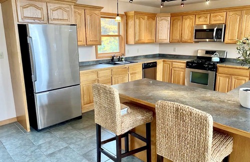 Town of Macomb Cabine | Stunning lake cabin 8 acres of woods, private boat dock, AC, WiFi & dog-friendly