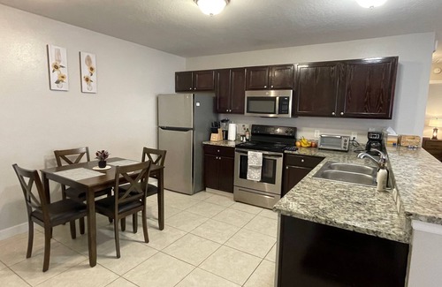 Duval Maison | Stylish Home in Duval w/Granite, Tile Floors, Glass Lanai & Gas Golf Cart!