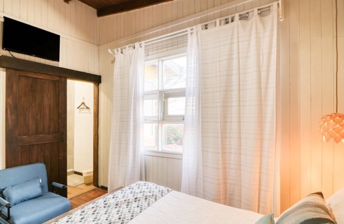 La Cruz Maison | Stylish hotel suite in family hotel with bay views, fast WiFi, & restaurant