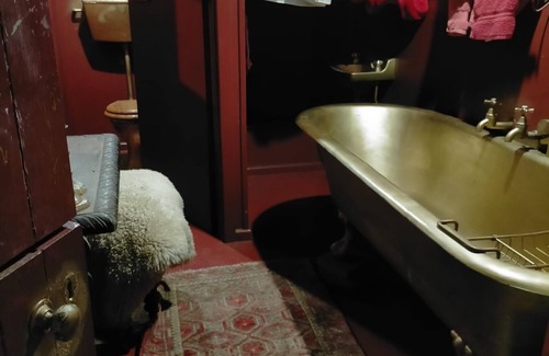 Akaroa Maison | Stylish vintage caravan on a farm over looking bush and river.