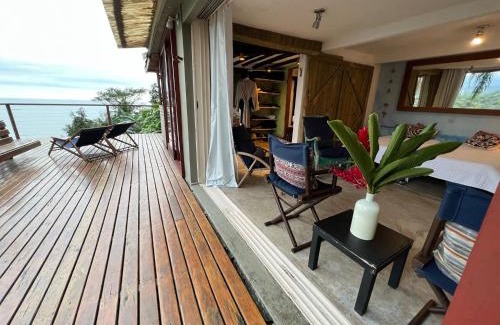 Maresias Villa | Suíte e sala - Vista Barra do Sahy