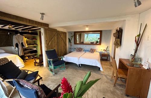 Maresias Villa | Suíte e sala - Vista Barra do Sahy