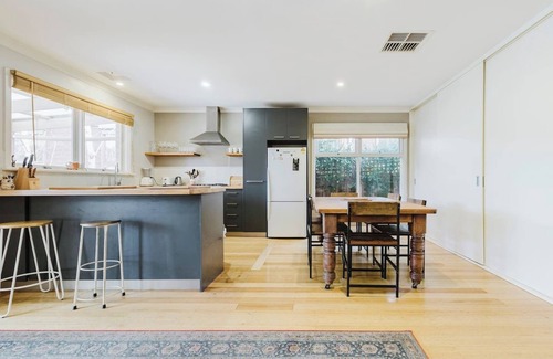 Kensington Maison | Tangerine Gleam Cheerful Inner City Family Abode