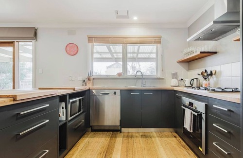 Kensington Maison | Tangerine Gleam Cheerful Inner City Family Abode