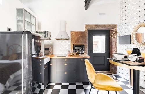 Corcubion Appartement | The 20's Suite. Loft with bathtub, outdoor terrace and wood-burning fireplace.