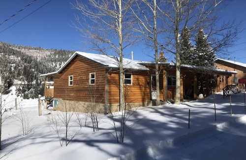 Holman Cabine | The Cabin back deck offers stunning views and only 15 minutes from Sipapu Skiing