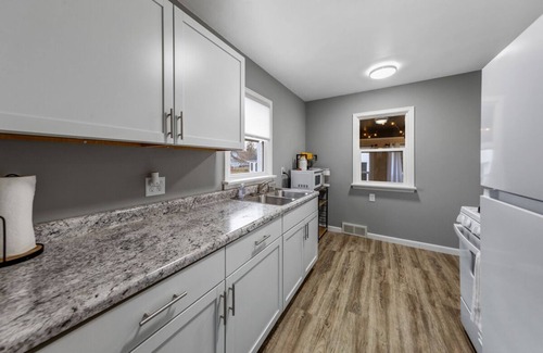 Saint James Maison | The Christine - 3 bed, 2 bath house has wifi, a work space, and 3 season porch.