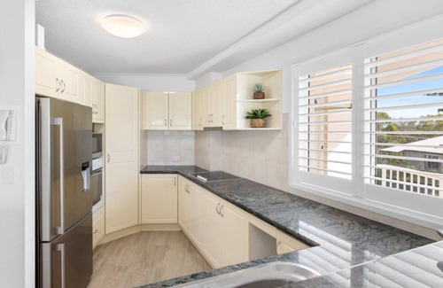 Currimundi Appartement | THE ENTRANCE UNIT 5 - Relax on a sunlit balcony overlooking Currimundi Lake, with birds singing in t