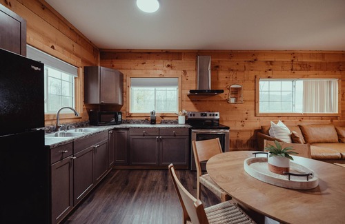 South Bloomingville Cabine | The Hideout - Escape to The Hideout in Hocking Hills, OH! This cozy, pet-friendly cabin offers a private deck by Pine Creek, just minutes from hiking, waterfalls, and caves. Perfect for up to 4 guests. Book your nature-filled getaway today!