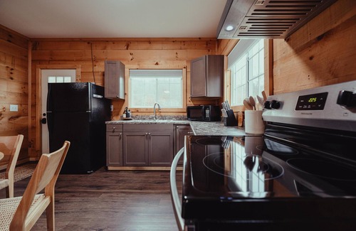 South Bloomingville Cabine | The Hideout - Escape to The Hideout in Hocking Hills, OH! This cozy, pet-friendly cabin offers a private deck by Pine Creek, just minutes from hiking, waterfalls, and caves. Perfect for up to 4 guests. Book your nature-filled getaway today!