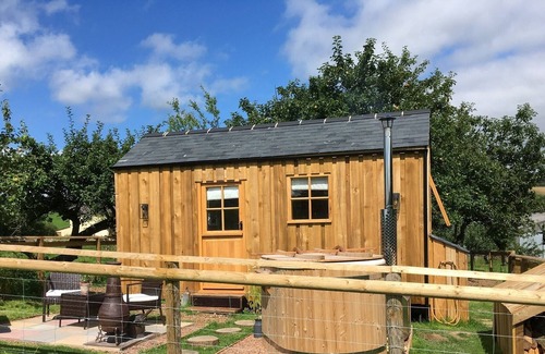 Brushford Maison | The Orchard Hut- A bespoke shepherds hut with wood fired hot tub.
