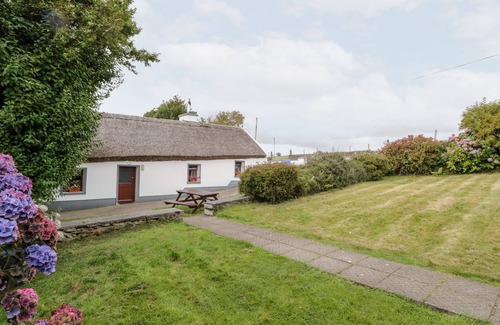 Carrowkennedy Cottage | THE THATCHED COTTAGE, pet friendly in Drummin, County Mayo