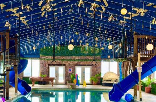Bryant Maison | This is IT Cabin with a hot tub fire pit & indoor pool