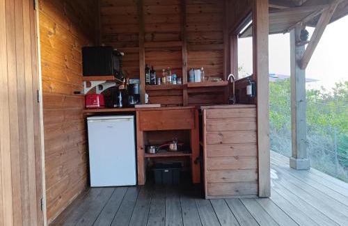 Grand Anse Maison | TI KAZ ANOLI Cottage en bois avec vue sur la baie