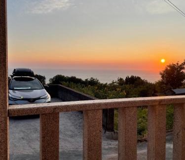 Oia Maison | Tiny house with sunset over the ocean