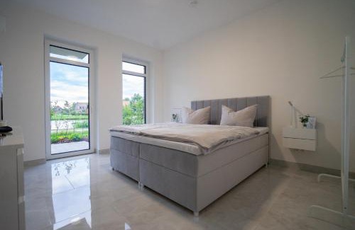 Rhauderfehn Appartement | Tomkes Ferienwohnung am See