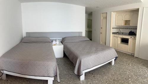 Club Deportivo Appartement | Torres gemelas - Suite equipada con vista a la bahía
