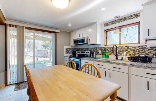 Sandown Maison | Two-story dog-friendly home with a lake view, deck, gas grill