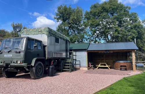 Usk Maison | Unique stay in your very own army truck. Sleeps 4. Hot tub. Tranquil setting.