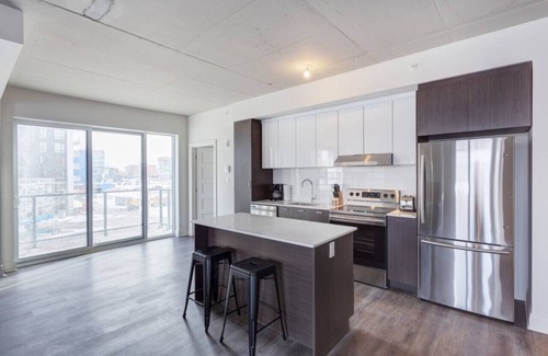 Laval Appartement | Urban 2BR Escape In-suite Laundry and Terrace