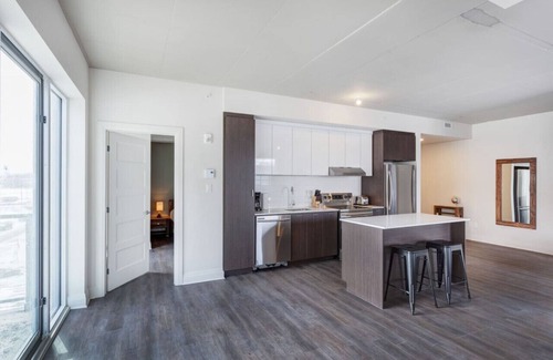 Laval Appartement | Urban 2BR Escape In-suite Laundry and Terrace