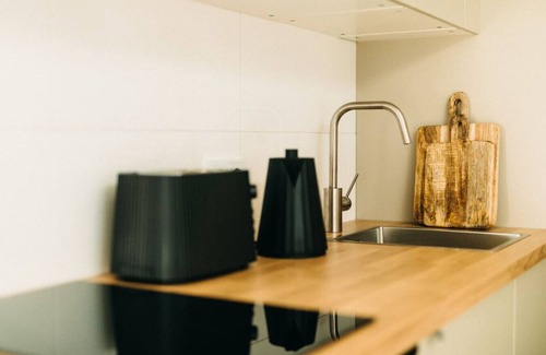 Friedrichstadt Appartement | Urban Elegance | Balcony | Bright Design Oasis