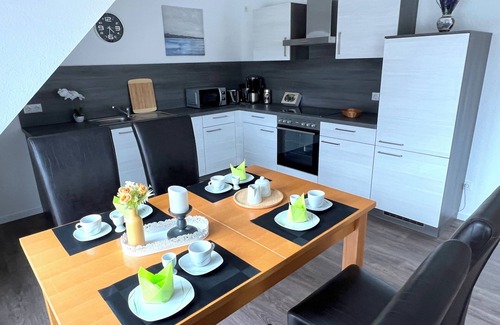 Papenburg Appartement | Vacation apartment "Aurora" Papenburg Large balcony EBK New building 74 sqm Free Wifi 2 bedrooms