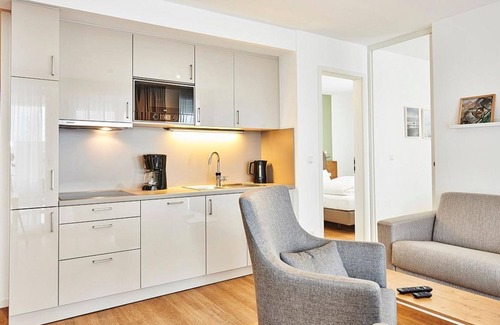Bensersiel Appartement | Vacation apartment close to the beach with large balcony incl. use of swimming pool & sauna - Deichhäuser Anna